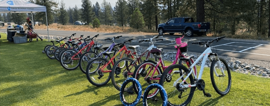 Featured image showing a line of gently used mountain bikes for sale at the annual TEA Gear Market Fundraiser in Truckee, CA