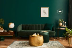 featured image showing a beautiful living room decorating in rich, deep emerald green and gold.